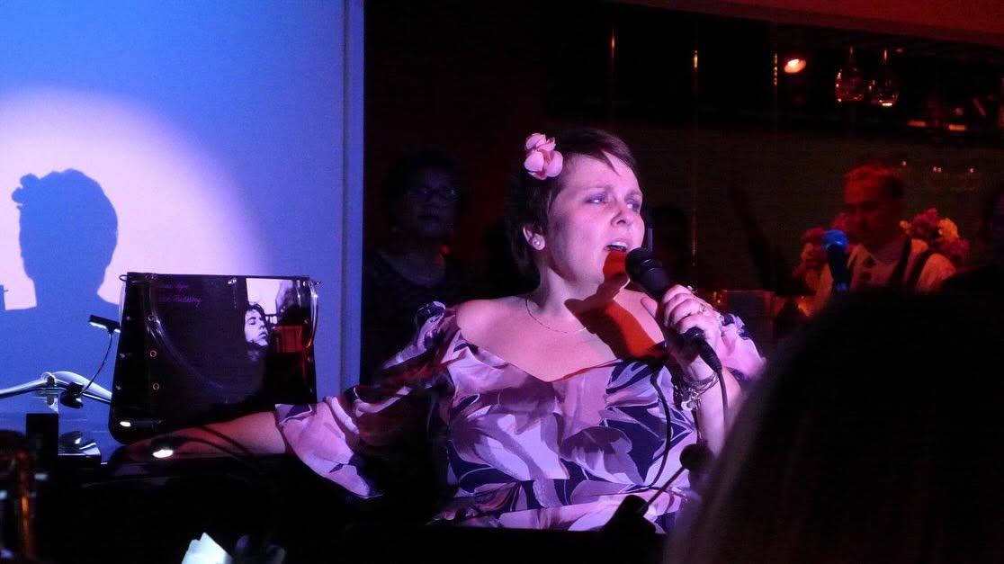 MaryJo Mundy singing on stage at the Gardenia